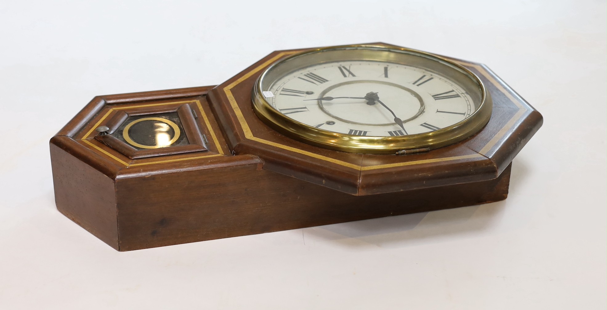 A late 19th century American mahogany drop dial wall clock, height 54 cms.